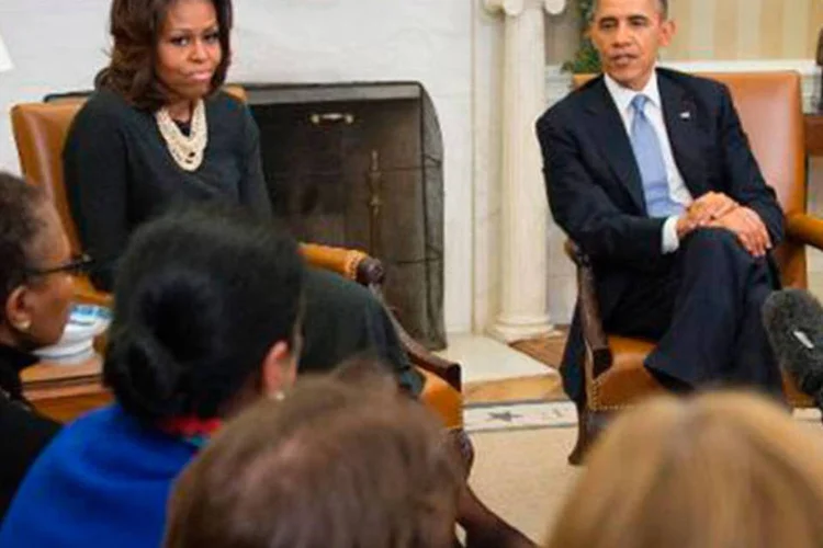 
	Barack e Michelle Obama: casal tem se esfor&ccedil;ado para manter as filhas Malia e Sasha fora do escrut&iacute;nio p&uacute;blico
 (JIM WATSON/AFP)