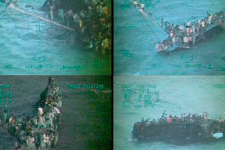 Imagens divulgadas pela Guarda Costeira norte-americana mostra resgate de haitianos em barco que naufragou na região das Bahamas
 (Ho/AFP)
