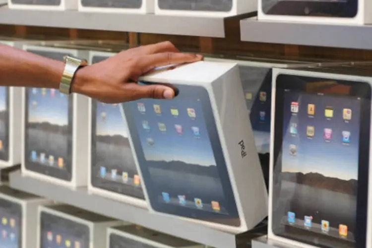 
	iPad: a perspectiva &eacute; de um crescimento mais forte de tablets e smartphones do que de notebooks e PCs
 (Ian Gavan/Getty Images)