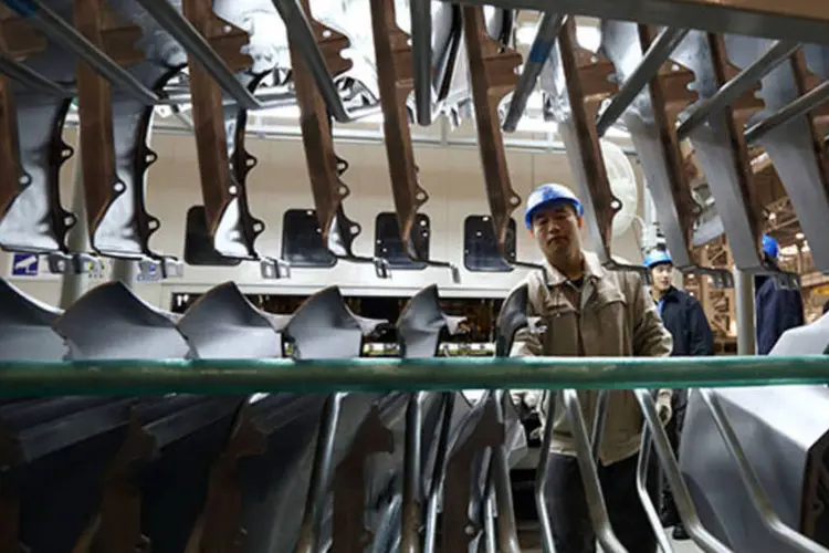 
	Trabalhador da Hyundai em Beijing: os 45.000 trabalhadores sindicalizados pretendem paralisar as atividades por quatro horas na sexta e na pr&oacute;xima segunda
 (Tomohiro Ohsumi/Bloomberg)