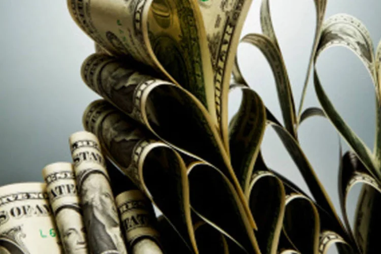 
	C&eacute;dulas de d&oacute;lar: A concess&atilde;o da hidrel&eacute;trica foi marcada por pol&ecirc;micas
 (Getty Images)