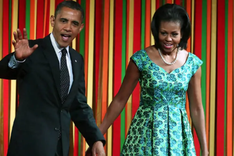 Obama e Michelle: a primeira-dama admitiu que exista algumas coisas que ainda lhe incomodam, como quando se vê obrigada a esperar seu marido (Alex Wong/Getty Images/AFP)