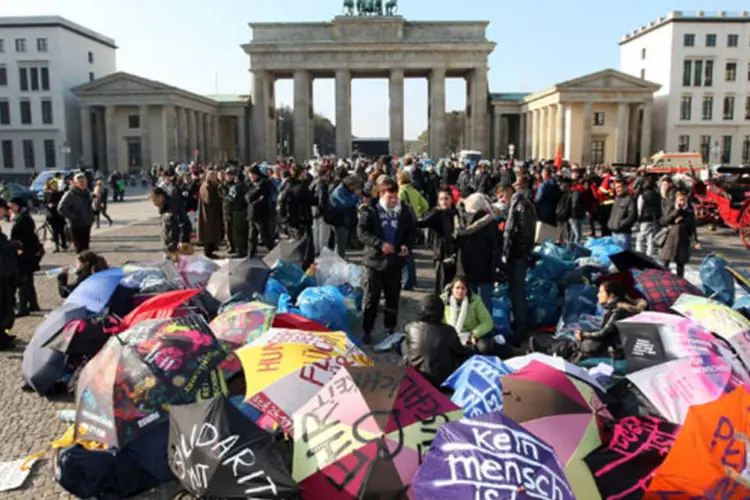 
	Manifestantes pedem por direito de refugiados na Alemanha
 (Adam Berry/Getty Images)
