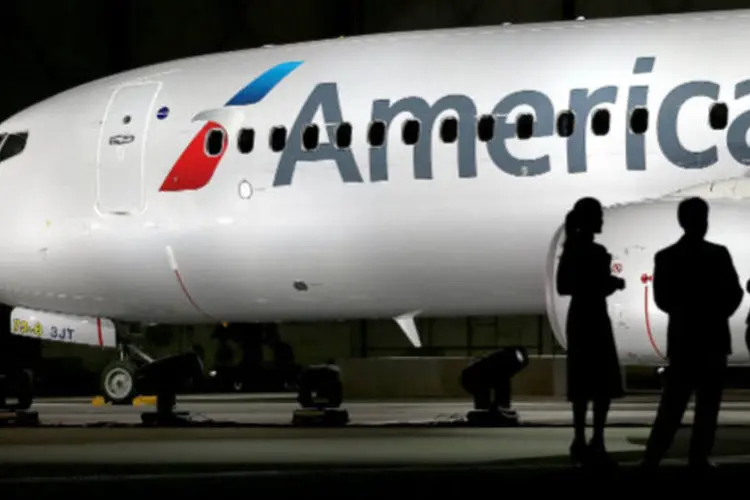 
	Avi&atilde;o da American Airlines: segundo o jornal&nbsp;&quot;The Wall Street Journal&quot;,&nbsp;o Departamento de Justi&ccedil;a anunciar&aacute; ainda hoje os detalhes sobre o acordo
 (Tom Pennington/Getty Images)