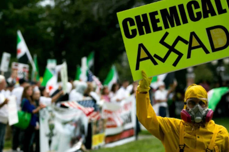 
	Manifestantes a favor de poss&iacute;vel interven&ccedil;&atilde;o militar norte-americana na S&iacute;ria: observa&ccedil;&otilde;es do general Yair Golan s&atilde;o um reflexo do debate em Israel sobre o destino de Assad
 (Getty Images)