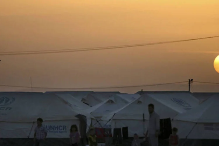 
	Campo de refugiados s&iacute;rios Al Zaatri, na Jord&acirc;nia:&nbsp;em 2012, 647 mil pessoas deixaram a S&iacute;ria para se refugiar em outros pa&iacute;ses, maior deslocamento anual de uma &uacute;nica nacionalidade desde a Guerra do Kosovo, em 1999.
 (/Muhammad Hamed/Reuters)