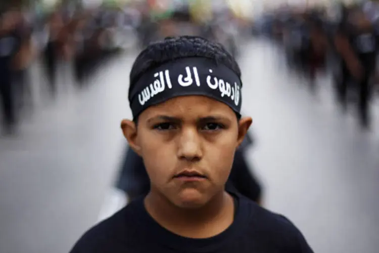 Menino palestino em uma manifestação para o dia da Nakba, na cidade de Ramallah, na Cisjordânia (Mohamad Torokman)