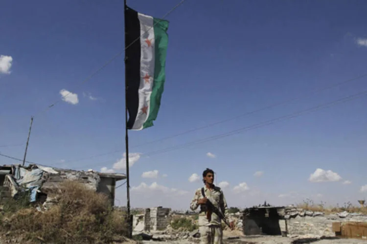 
	Militante s&iacute;rio: &quot;Assim que o governo da S&iacute;ria confirmar sua aceita&ccedil;&atilde;o das modalidades, a miss&atilde;o partir&aacute; sem demora&quot;, disse a ONU em comunicado
 (Muzaffar Salman/Reuters)