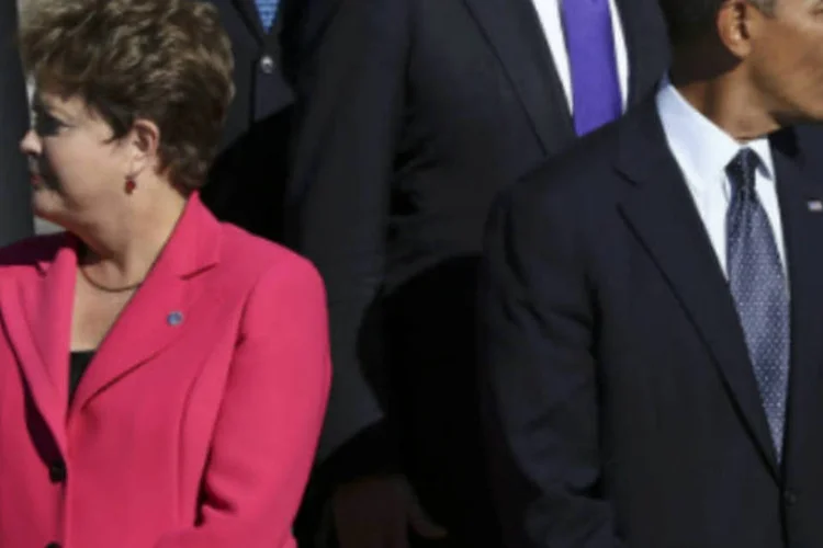 
	Dilma e Obama durante encontro do G20: presidente&nbsp;est&aacute; aguardando uma &quot;resposta satisfat&oacute;ria&quot; dos Estados Unidos para confirmar a sua viagem
 (Sergei Karpukhin/Reuters)