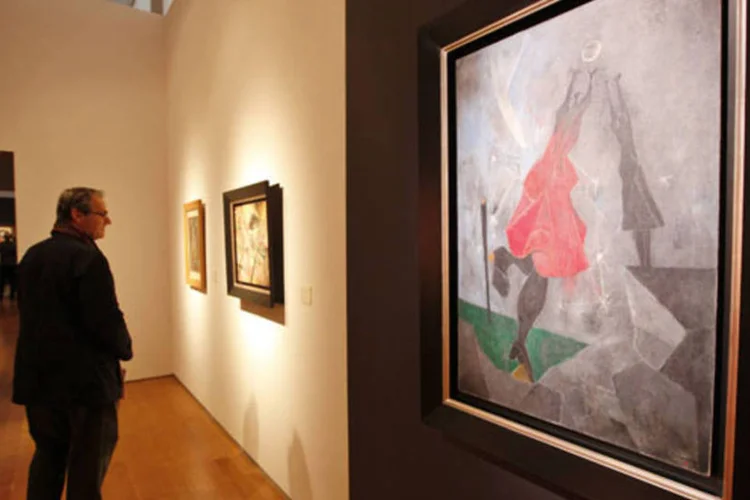 Obra "Mulheres Alcançando a Lua", do artista mexicano Rufino Tamayo", durante a apresentação do leilão de arte latino-americana em Nova York (Mike Segar/Reuters)