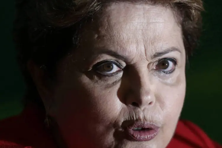 
	Dilma fala com jornalistas: a presidente e sua comitiva jantaram em um dos restaurantes mais badalados da cidade e se hospedaram nos hot&eacute;is Ritz e Tivoli - 45 quartos foram usados
 (Ueslei Marcelino/Reuters)
