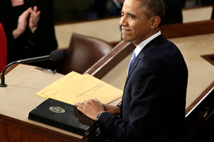 
	Barack Obama pisca para a primeira-dama ap&oacute;s chegar para discursar no Capit&oacute;lio: Obama evidenciou o interesse dos EUA no aumento das rela&ccedil;&otilde;es comerciais com a regi&atilde;o
 (REUTERS/Gary Cameron)