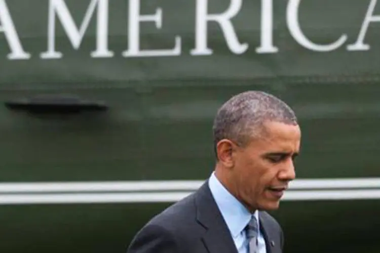 
	Obama chega &agrave; Casa Branca, em Washingon: a Casa Branca prometeu conter as atividades de espionagem dos servi&ccedil;os americanos ap&oacute;s uma onda de protestos
 (Saul Loeb/AFP)