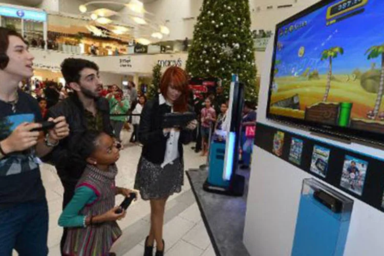 
	Estrelas da Disney jogam videogames: a divis&atilde;o perdeu US$ 87 milh&otilde;es no exerc&iacute;cio fiscal conclu&iacute;do no fim de setembro
 ( Michael Buckner/AFP)