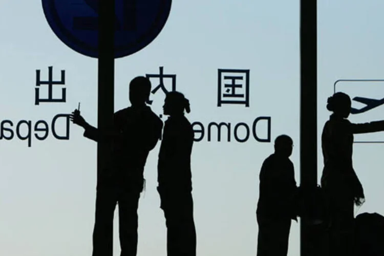 
	Volume de viagens internacionais realizadas por turistas chineses cresceu de 10 milh&otilde;es em 2000 para 83 milh&otilde;es em 2012
 (Feng Li/Getty Images)