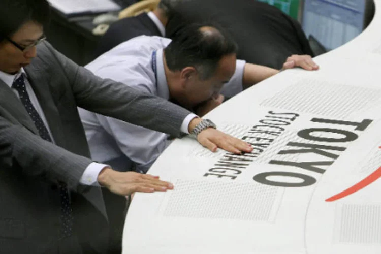 
	Bolsa de T&oacute;quio: o &iacute;ndice Nikkei ganhou 1,2%, terminado o preg&atilde;o com 13.382,89 pontos, ap&oacute;s queda de 0,4% da sess&atilde;o anterior
 (Kiyoshi Ota/Getty Images)