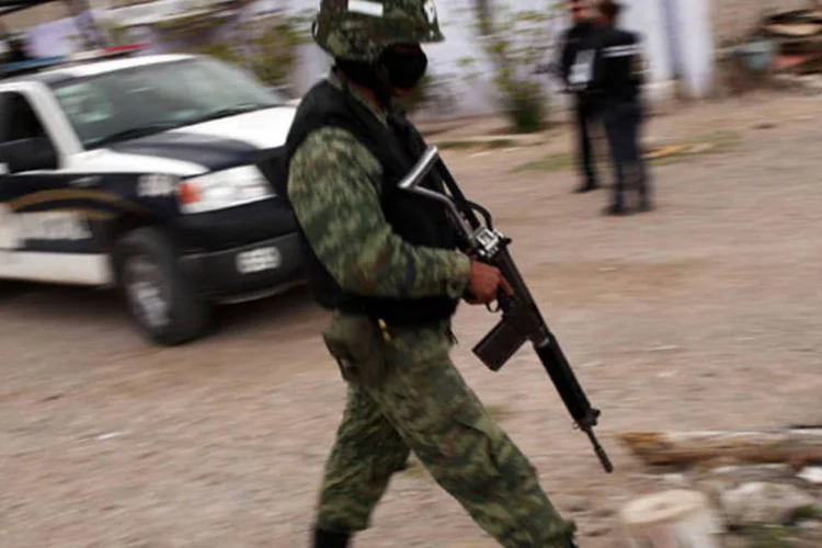 
	Viol&ecirc;ncia urbana no M&eacute;xico: no confronto armado, participaram soldados da Pol&iacute;cia Federal que realizavam trabalhos de vigil&acirc;ncia quando se toparam com um grupo de criminosos
 (Spencer Platt/Getty Images)