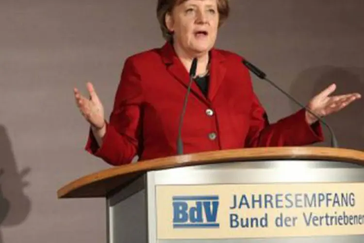 O novo chefe do Palácio do Eliseu será recebido em Berlim ''de braços abertos'', insistiu Merkel (Wolfgang Kumm/AFP)