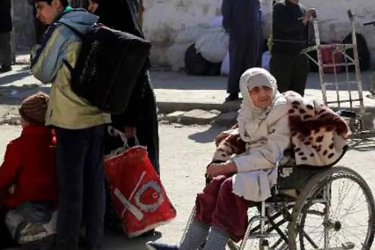 Sírios se preparam para deixar cidade velha de Homs com a ajuda da ONU (Afp.com / MOHAMMED WESAM)