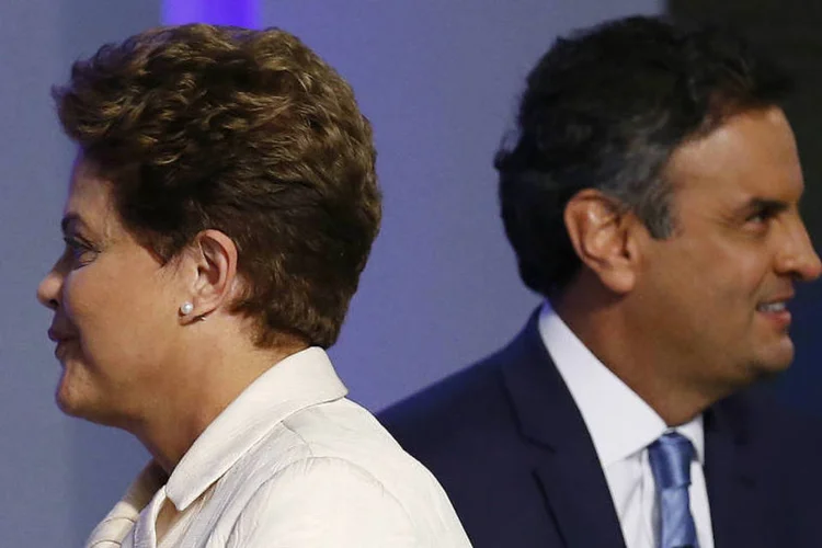 
	A&eacute;cio Neves e Dilma Rousseff em debate: Dilma obteve 41,59% dos votos, e A&eacute;cio 33,55%
 (REUTERS/Ricardo Moraes)