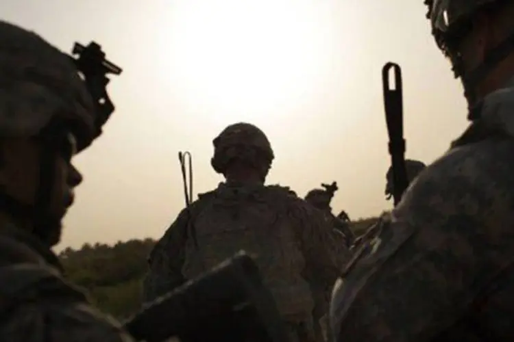
	Militares americanos no Afeganist&atilde;o: um dia antes, tr&ecirc;s soldados americanos foram mortos a tiros por um policial afeg&atilde;o que os convidou para uma refei&ccedil;&atilde;o
 (Spencer Platt/Getty Images/AFP)