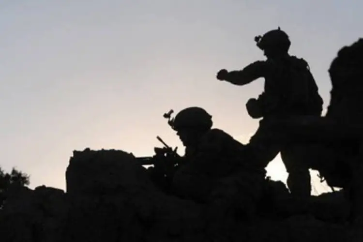
	Soldados americanos no Afeganist&atilde;o: o Iraque continua buscando seu rumo ap&oacute;s dez anos da invas&atilde;o americana.
 (Munir Uz Zaman/AFP)