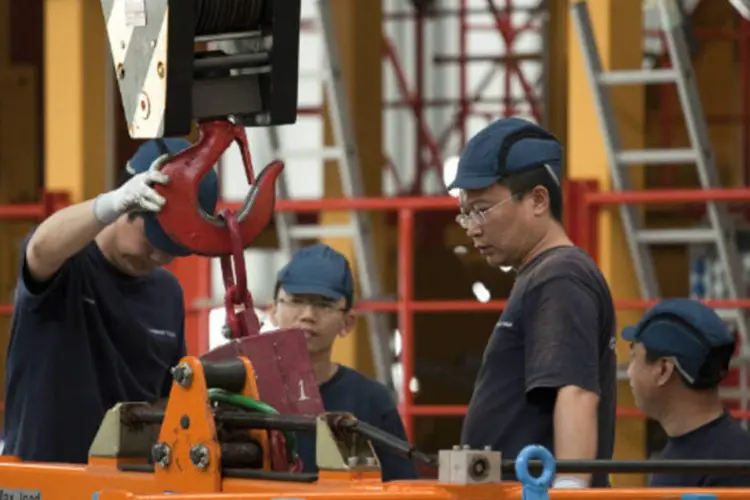 Produção industrial chinesa aumentou 6,4 por cento em julho em relação ao ano anterior, o ritmo mais lento desde janeiro (Nelson Ching/Bloomberg)