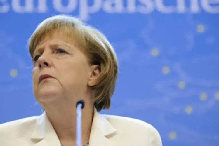 Merkel: o jornal Die Welt dramatizou ao falar de uma "noite de derrota" para Merkel, que "entrará nos livros da história"
 (John Thys/AFP)