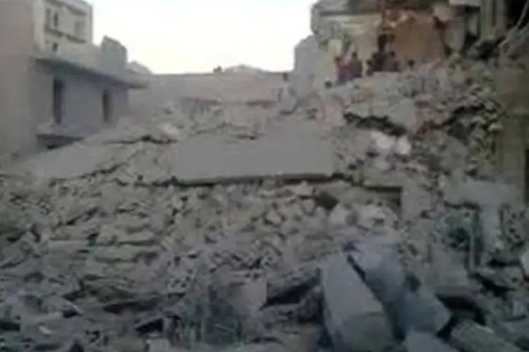 
	Um pr&eacute;dio destru&iacute;do em Alepo, na S&iacute;ria: dois im&oacute;veis foram destru&iacute;dos na cidade
 (AFP)