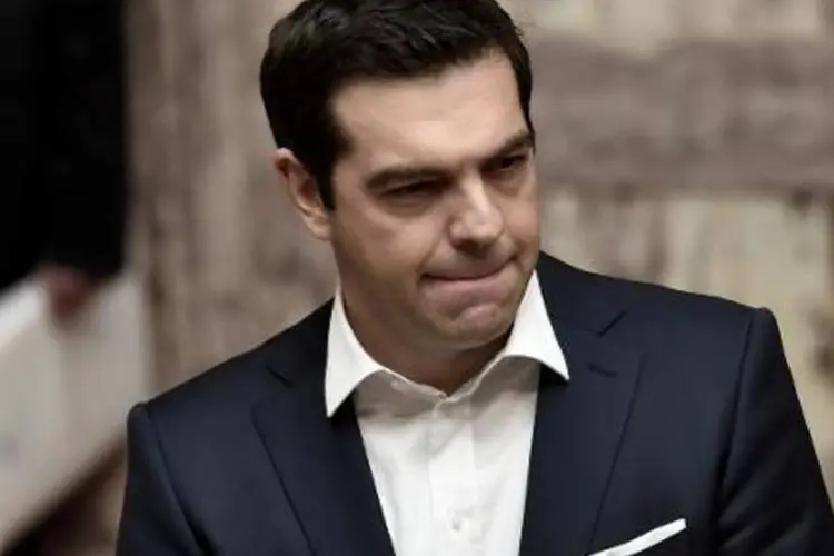 O premier grego, Alexis Tsipras: "a questão será resolvida a nível político até o final da semana, até a reunião de cúpula de chefes de Estado e de Governo da UE e, se necessário, durante esta reunião" (Aris Messinis/AFP)