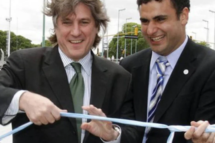 Subsecretário de Comércio argentino (D), morto em Montevidéu, junto ao vice-presidente Amado Boudou: ao que parece, o subsecretário comete suicídio (AFP)