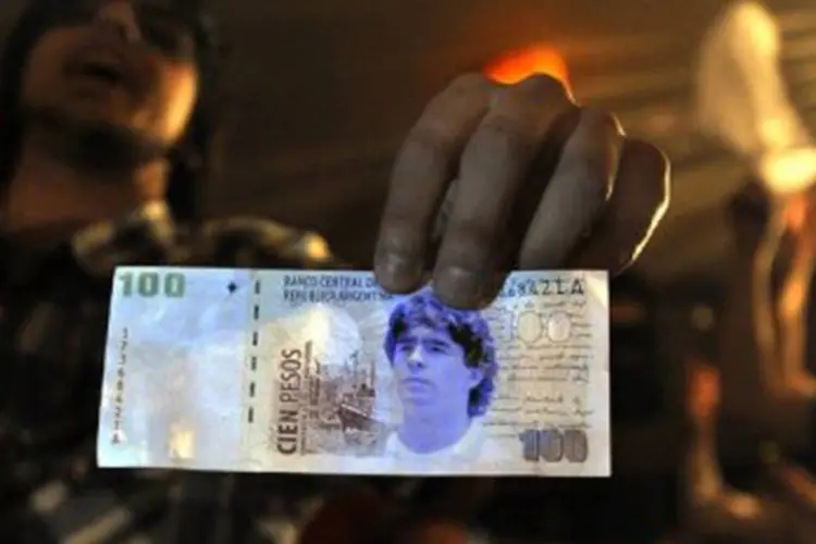 
	Peso argentino: Echegaray estima que a Argentina chega a destruir 400 milh&otilde;es de pesos por semana em c&eacute;dulas desgastadas
 (Daniel Garcia/AFP)