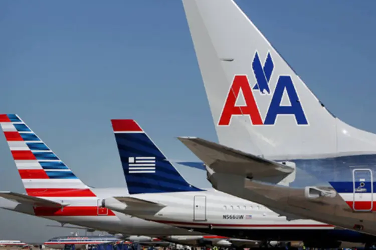 AMR e US Airways: companhias aéreas garantiram a aprovação da UE para a proposta de fusão em 5 de agosto, depois de prometer entregar slots em dois aeroportos (Bloomberg)