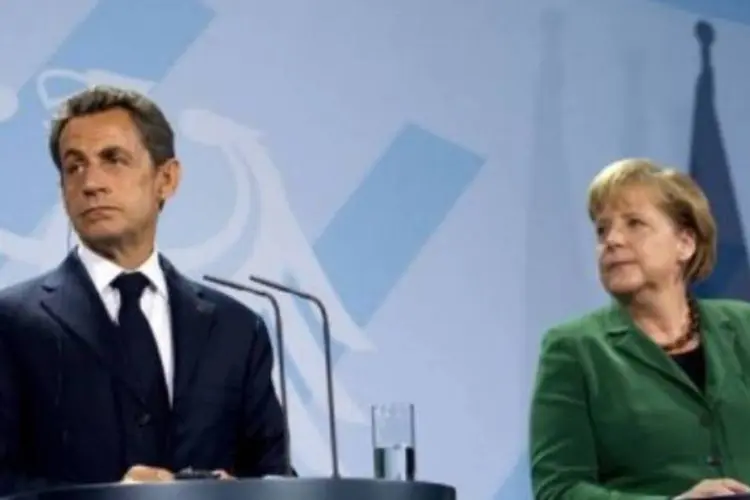 Sarkozy e Merkel prometeram fazer todo o possível para recapitalizar os bancos europeus (AFP/Johannes Eisele)