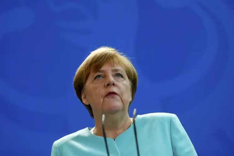 
	Angela Merkel: Merkel insistiu que sua decis&atilde;o de receber os migrantes em massa em 2015 foi boa
 (Hannibal Hanschke / Reuters)