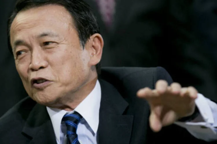 
	O ministro das Finan&ccedil;as, Taro Aso, afirmou que adiar o aumento iria contra os compromissos assumidos pelo Jap&atilde;o perante o G20
 (Andrew Harrer/Bloomberg)