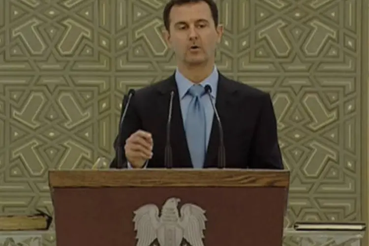 
	Bashar al-Assad: oposi&ccedil;&atilde;o no ex&iacute;lio e a interna buscam, entretanto, negociar um governo de transi&ccedil;&atilde;o
 (Syria TV via Reuters/Reuters)