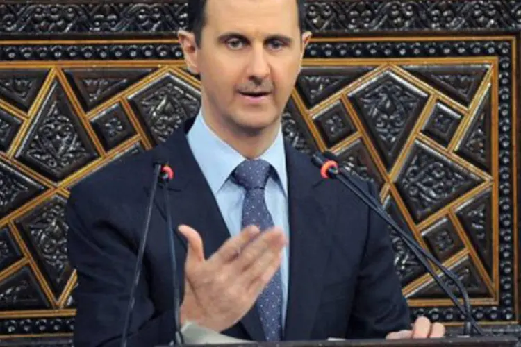 O presidente sírio Bashar al-Assad: tropas reconquistaram bairros de Damasco para quebrar ofensiva rebelde (AFP)