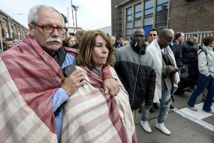 
	Atentado: pelo menos 34 pessoas morreram e 136 ficaram feridas nos atentados perpetrados hoje em Bruxelas
 (Dirk Waem / AFP)