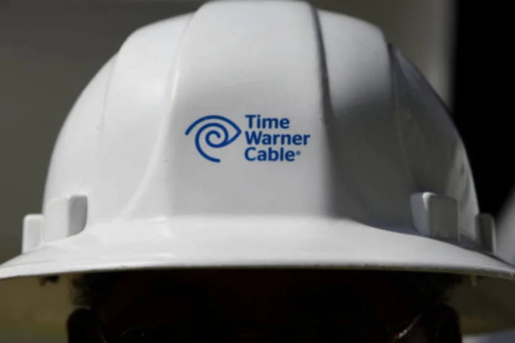 
	T&eacute;cnico da Time Warner Cable: grupo de procuradores est&aacute; focando mais na banda larga do que na TV a cabo ao analisar o acordo de US$ 45,2 bilh&otilde;es
 (Patrick Fallon/Bloomberg)