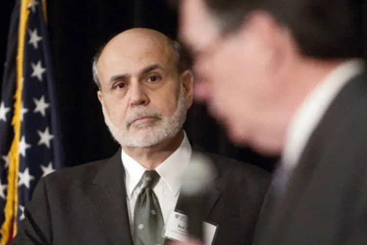 
	Ben Bernanke e Dennis Lockhart: mesmo depois que o banco comece a reduzir o QE, a pol&iacute;tica monet&aacute;ria deve ficar bem expansionista por um bom tempo, provavelmente durante anos, disse Lockhart
 (Joeff Davis/Bloomberg)