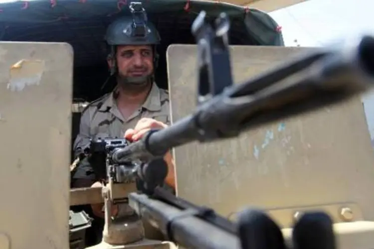 
	Blindado em Bagd&aacute;, Iraque: EUA podem mais tropas, provavelmente menos de 300
 (Amer al-Saedi/AFP)