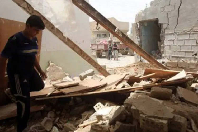 
	Pr&eacute;dio destru&iacute;do no Iraque: pa&iacute;s vive onda de atentados
 (Ahmad al-Rubaye/AFP)