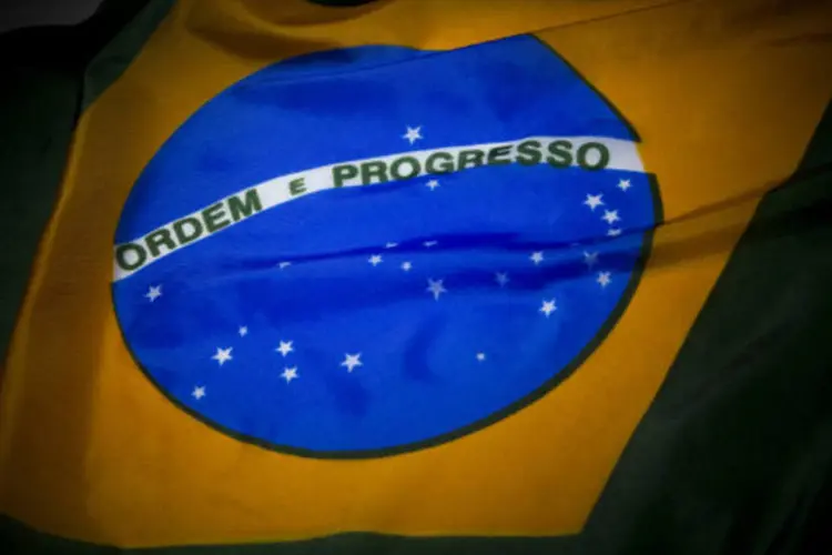 
	Bandeira do Brasil: a Moody&#39;s afirmou que o d&eacute;ficit em conta corrente do Brasil em 2014 &eacute; estimado em 4% do Produto Interno Bruto (PIB)
 (Scott Eells/Bloomberg)