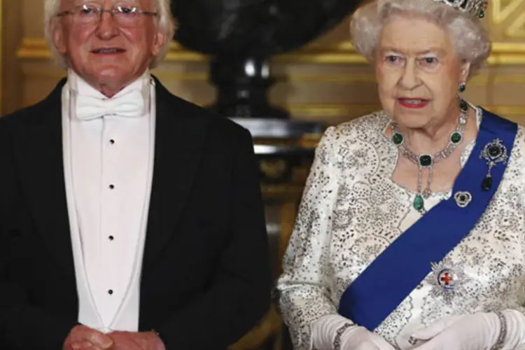 Presidente da Irlanda, Michael D. Higgins, e a Rainha Elizabeth II durante um banquete em Windsor, Inglaterra (Dan Kitwood/Reuters)