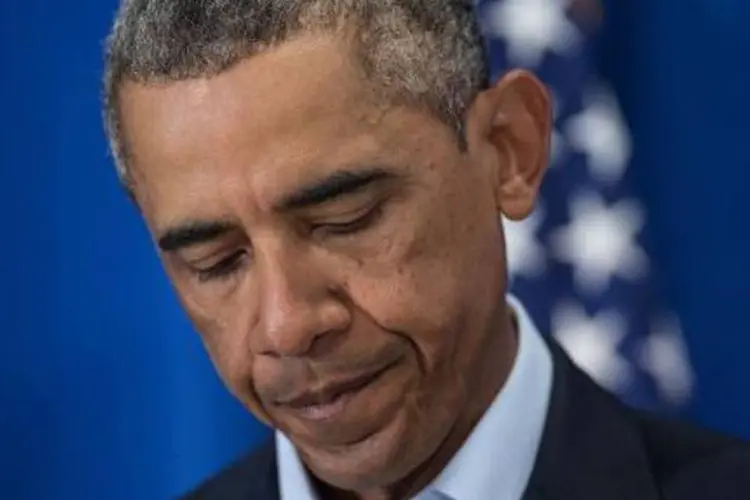 
	N&atilde;o est&aacute; f&aacute;cil nem para o presidente dos EUA: &quot;por sorte, Michelle estava com o dela!&quot;, brincou Obama
 (Nicholas Kamm/AFP)