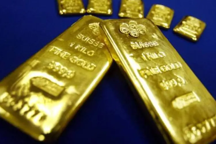 
	Barras de ouro: o contrato do metal com entrega para fevereiro registrou alta de 1,37% no preg&atilde;o desta quinta-feira
 (Mario Tama/Getty Images)
