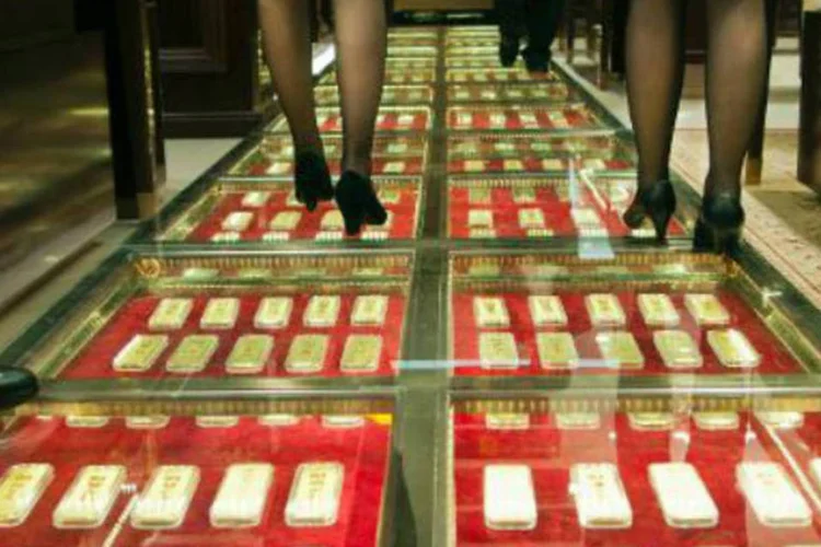 
	Barras de ouro: o contrato mais negociado, para entrega em agosto, subiu US$ 1, ou 0,1%
 (AFP)