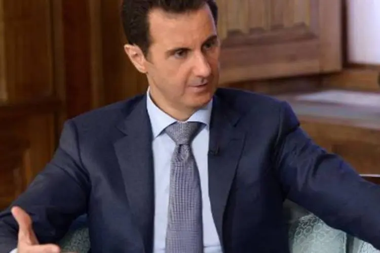 
	Bashar al-Assad: &quot;Apenas o povo s&iacute;rio pode definir quem vai ser o seu presidente, quando ele come&ccedil;a e quando deve sair&quot;
 (AFP)