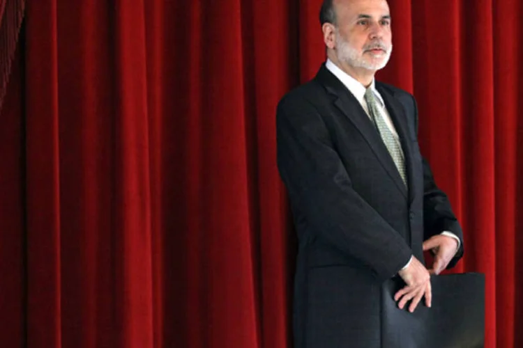 Ontem as bolsas fecharam em alta após o Fed carimbar que a data de validade do ciclo de afrouxamento monetário é de mais dois anos (Mario Tama/Getty Images)